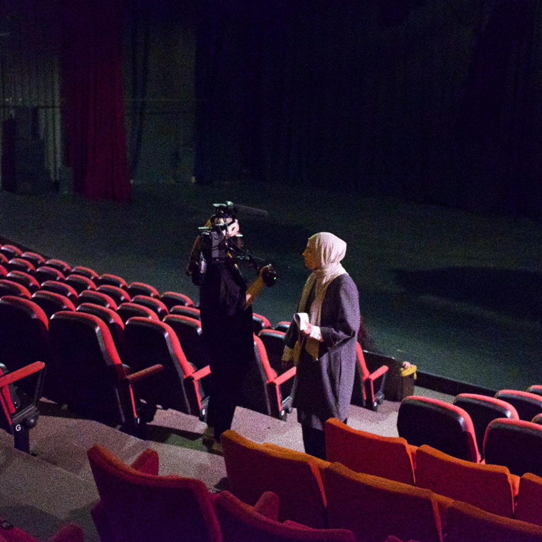 Jude Chehab, a Lebanese hijabi, films in a large empty movie theater.
