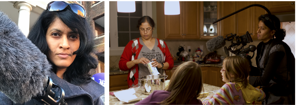 An Indian woman with medium length dark hair holds a camera. Two women stand in a kitchen, one of them filming, while two small 