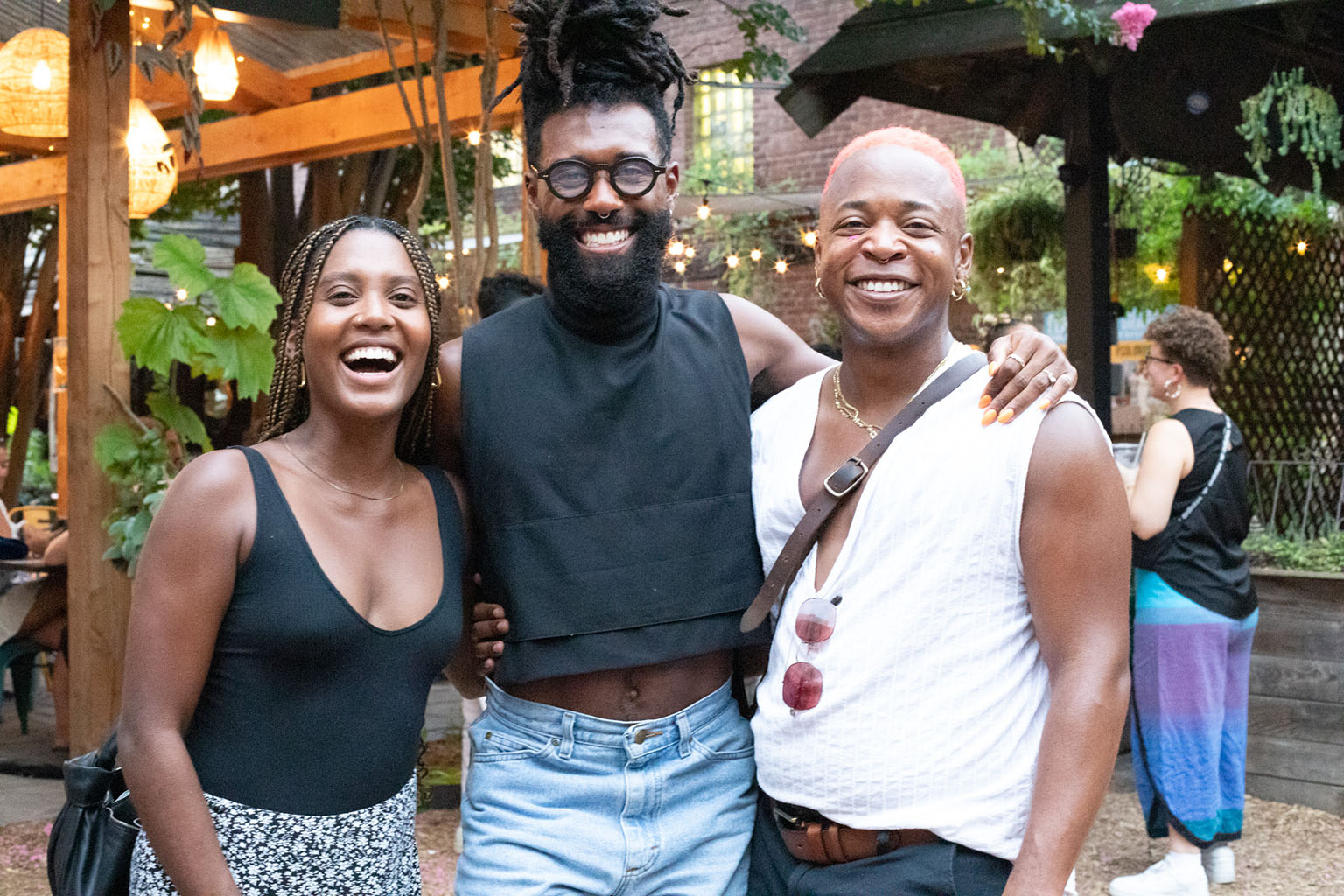 Three Black creatives pose for a photo, including Chandler Phillips and Elijah McKinnon.